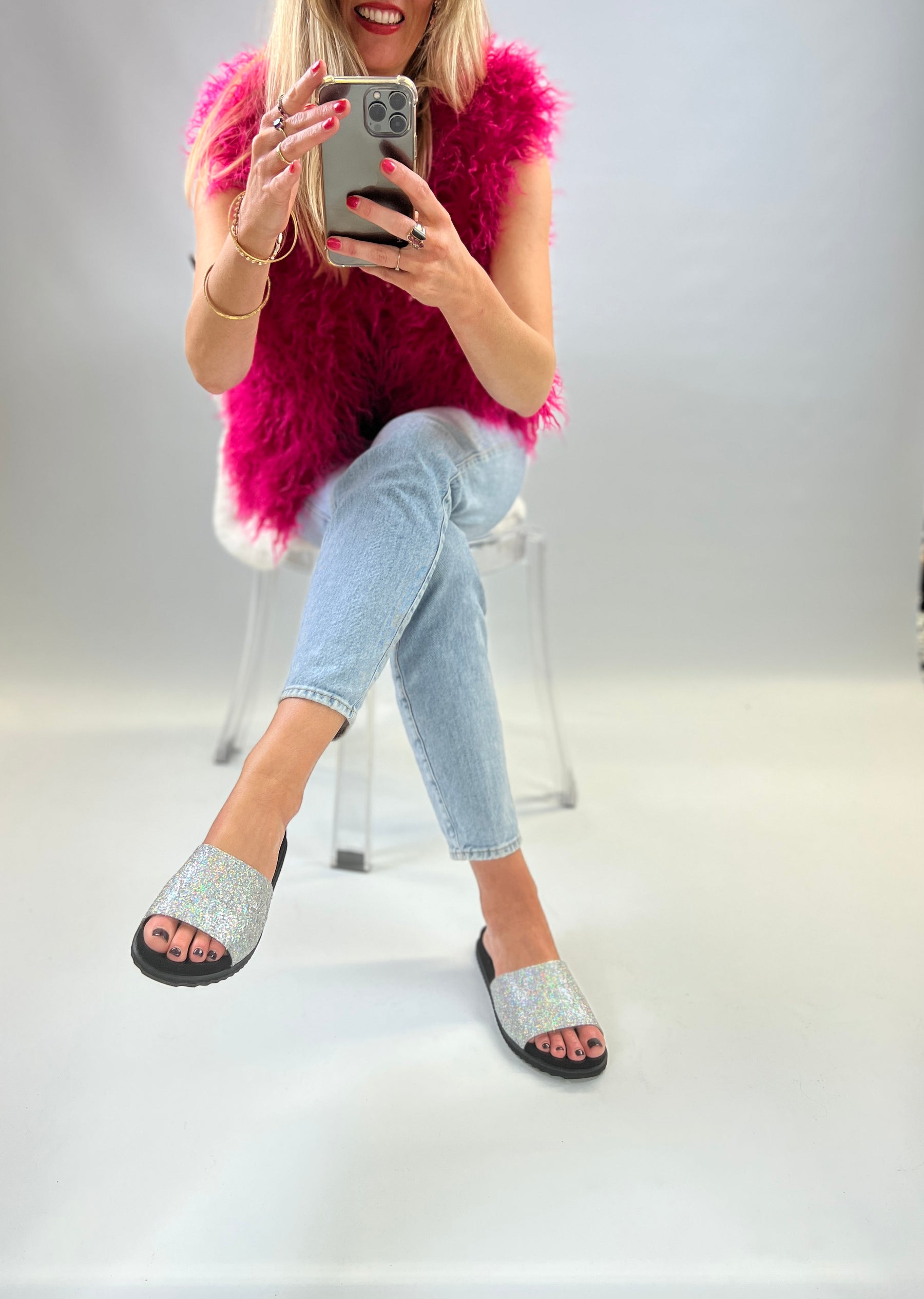 Slip on, silver sparkly sliders with an ergonomic microsuede innersole
