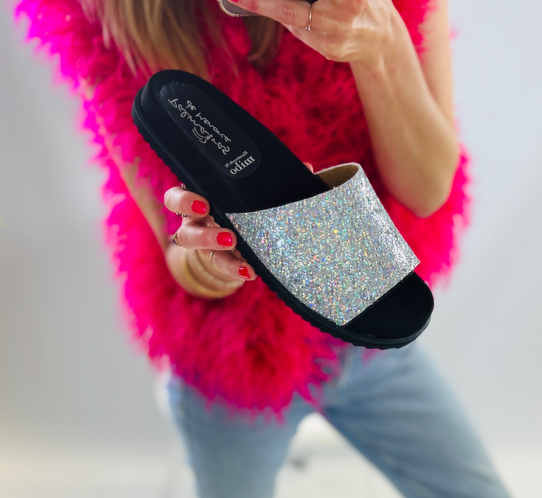 Slip on, silver sparkly sliders with an ergonomic microsuede innersole