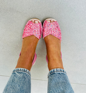 Iridescent candy pink glitter with a soft bubblegum pink leather heel strap. Comfortable, lightweight medium height cork wedge platform avarca sandals