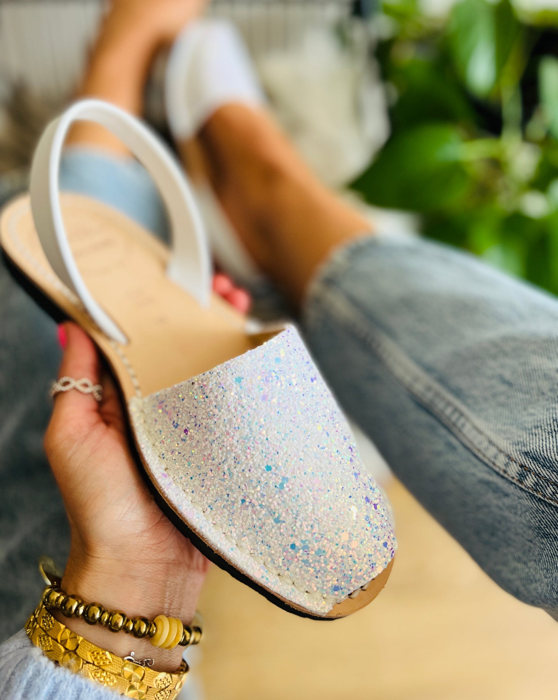 Irridescent white glitter uppers on a traditional menorcan avarca sandal with white leather slingback heel strap and flexible rubber sole