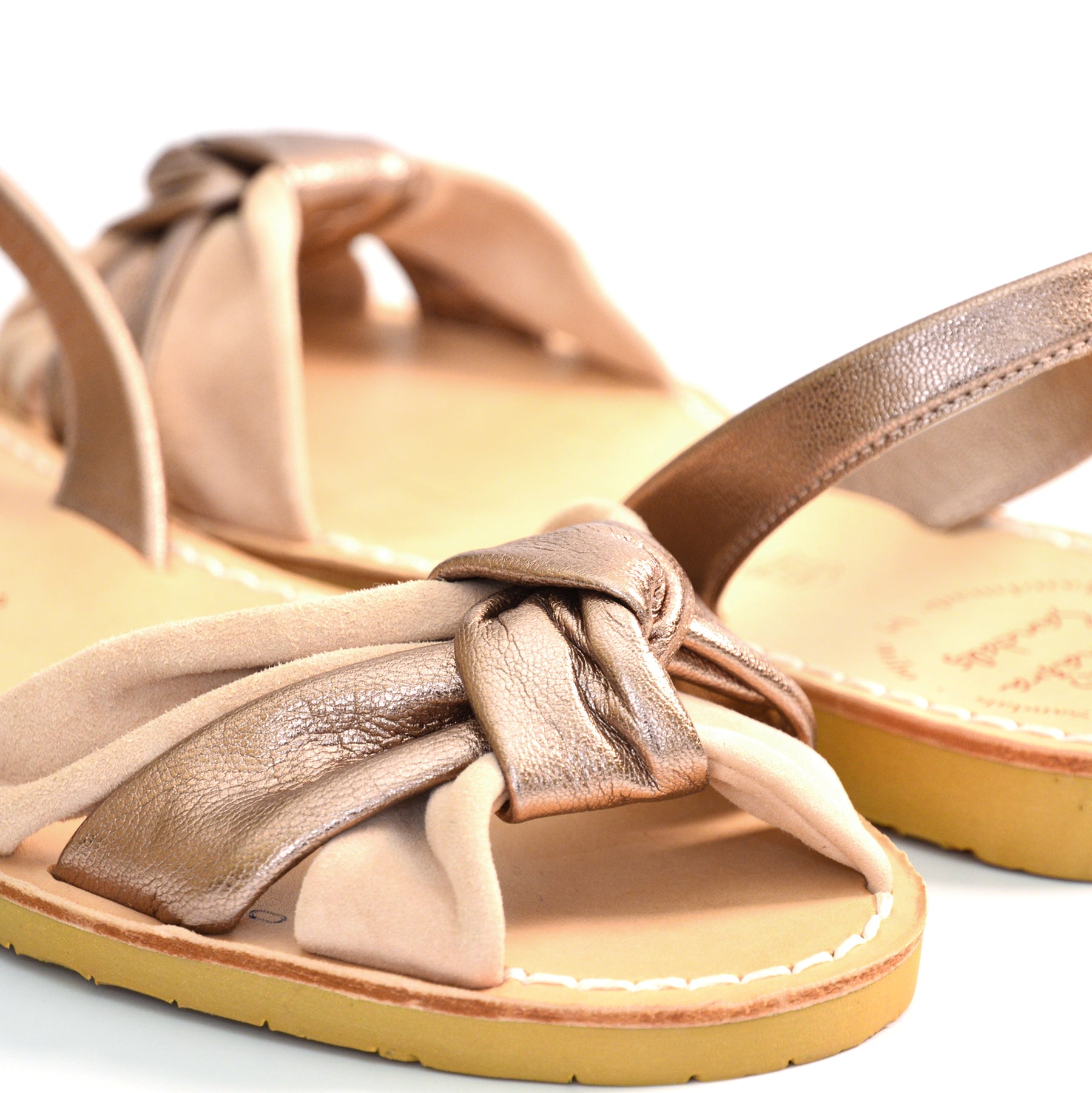 pale pink suede and metallic leather knotted peeptoe avarca sandals with flexible rubber sole and slingback.