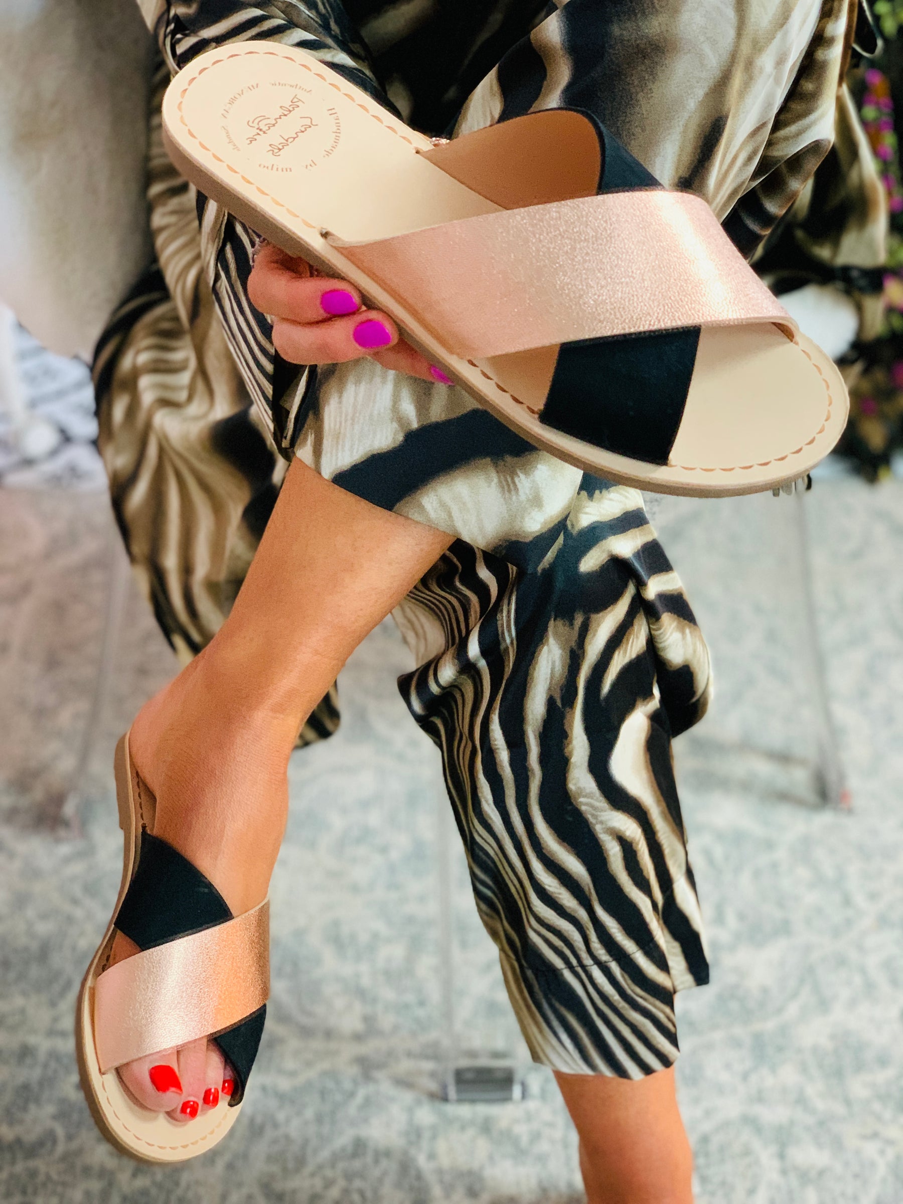 Onyx Crossover Slide black and rose gold strappy flat sandals