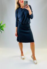 Black Cotton pull-on stretch skirt with adjustable drawstring tie waist and soft A-Line silhouette.