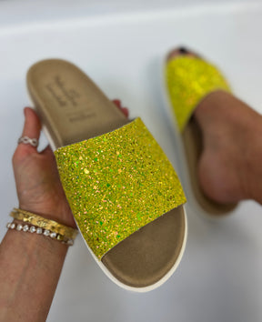  ﻿Slip on, lime sparkly sliders with an ergonomic microsuede innersole