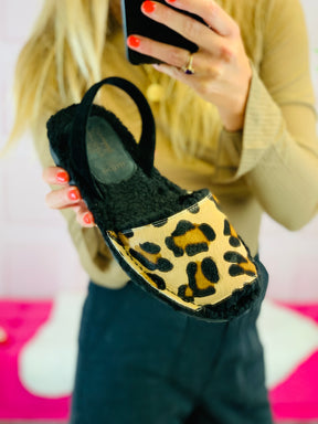 Leopard print hair on leather Menorcan Avarcas Slippers with a cosy black wool lining. 