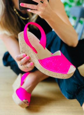 Bright pink glitter upper on an 8cm mid height cork wedge with neon pink napa leather slingback heelstrap