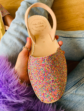 pastel multi coloured glitter upper on a traditional menorcan avarca sandal with neutral peach toned suede heelstrap and durable rubber sole.