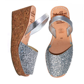 silver glitter mid height spanish avarca wedge sandals with cork sole.