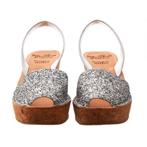 silver glitter mid height spanish avarca wedge sandals with cork sole.
