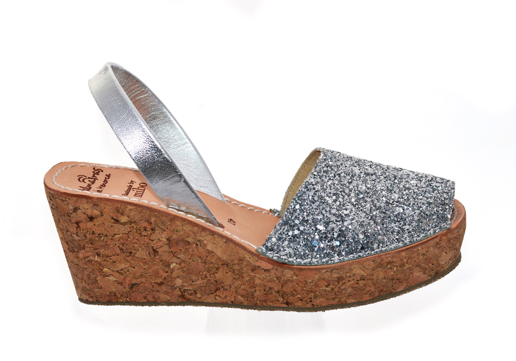 silver glitter mid height spanish avarca wedge sandals with cork sole.